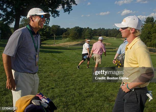 Anders Albertson, right, from Georgia Tech, talks to Brennan Webb, an assistant coach at Georgia Tech, after finishing his round on the eighth hole...