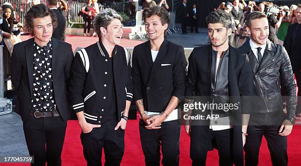 British boyband One Direction arrive to attend the world premiere of their film, 'One Direction: This Is Us' in central London on August 20, 2013....