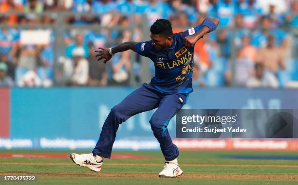Dilshan Madushanka of Sri Lanka celebrates the wicket of Shubman Gill of India during the ICC Men's Cricket World Cup India 2023 between India and...