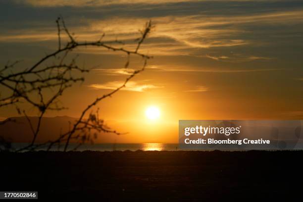 sunset over the salton sea - salton sea stock pictures, royalty-free photos & images