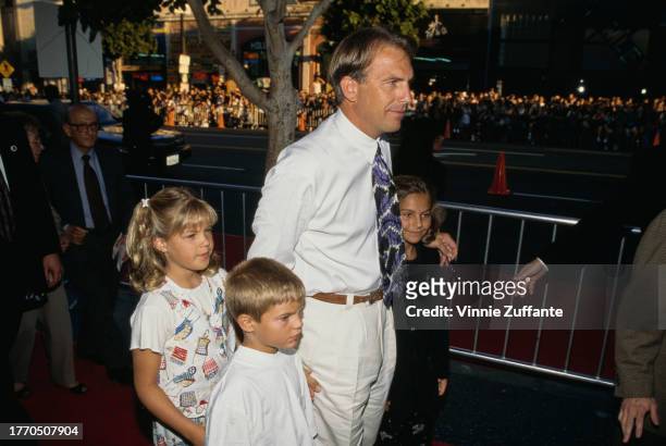 Kevin Costner, with his children Lily Costner, Joe Costner, and Annie Costner, and guests attend the Los Angeles premiere of "Waterworld" at the...