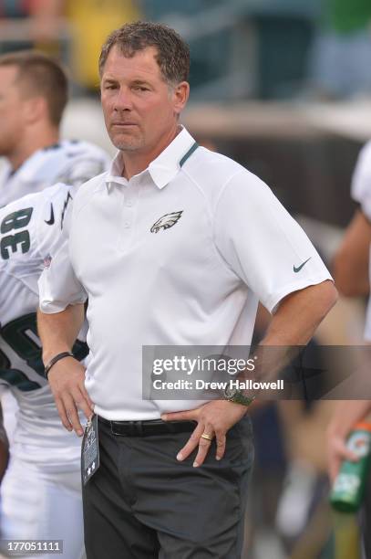 Coach Pat Shurmur of the Philadelphia Eagles watches warm ups before the game against the New England Patriots at Lincoln Financial Field on August...