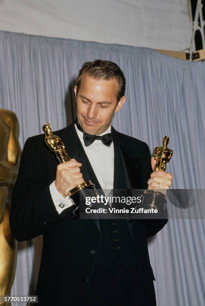 Kevin Costner wins the Best Picture and Best Director Oscars at the 63rd Academy Awards, for "Dances with Wolves" , at the Shrine Auditorium in Los...