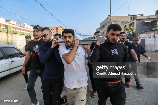 People mourn as they collect the bodies of Palestinians killed in Israeli air raids on November 2 2023 in Khan Yunis, Gaza. Approaching the fourth...