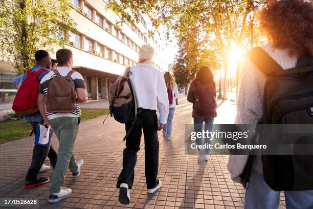 rear view of students going to the school in the morning. - secondary students stock pictures, royalty-free photos & images
