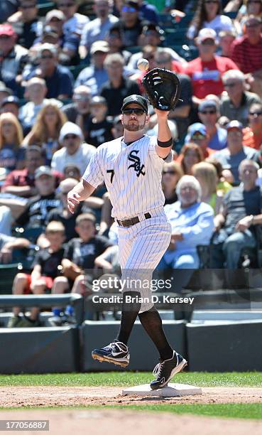 First baseman Jeff Keppinger of the Chicago White Sox catches the ball against the Detroit Tigers at U.S. Cellular Field on August 14, 2013 in...