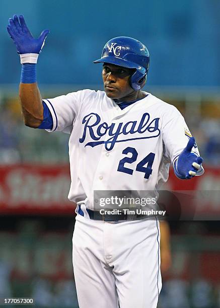 Miguel Tejada of the Kansas City Royals celebrates hitting a single in a game against the Boston Red Sox at Kauffman Stadium on August 10, 2013 in...