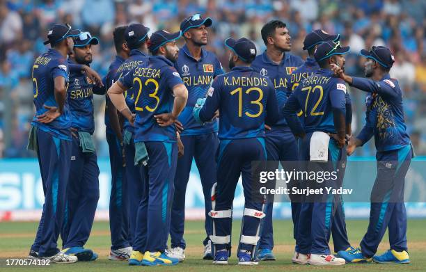 Dilshan Madushanka of Sri Lanka celebrates the wicket of Suryakumar Yadav of India during the ICC Men's Cricket World Cup India 2023 between India...