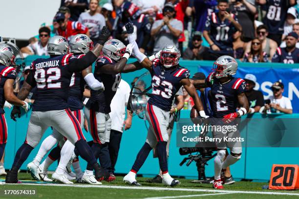 Kyle Dugger of the New England Patriots celebrates during an NFL football game against the Miami Dolphins at Hard Rock Stadium on October 29, 2023 in...