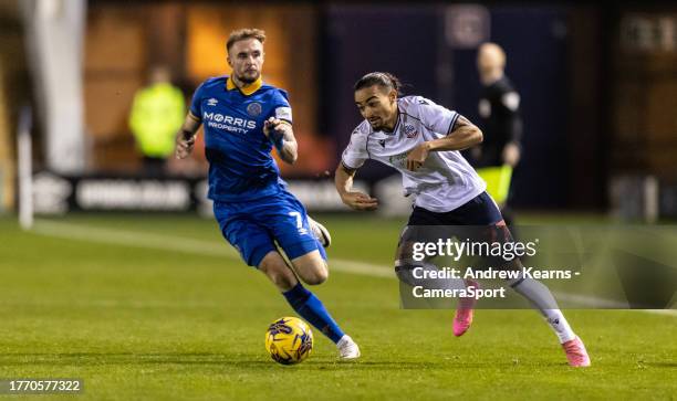 Bolton Wanderers' Randell Williams breaks away from Shrewsbury Town's Carl Winchester during the Sky Bet League One match between Shrewsbury Town and...