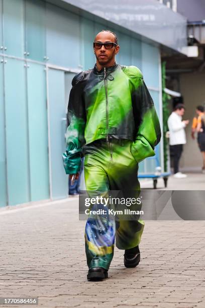 Lewis Hamilton of Great Britain and Mercedes enters the paddock during previews ahead of the F1 Grand Prix of Brazil at Autodromo Jose Carlos Pace on...