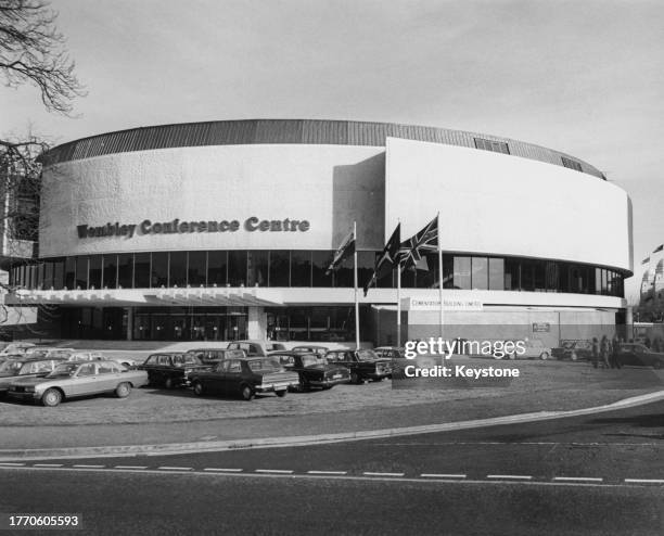 Cars parked in the car park before Wembley Conference Centre on Empire Way in Wembley Park, London, England, 1977. The Modern Movement building, the...