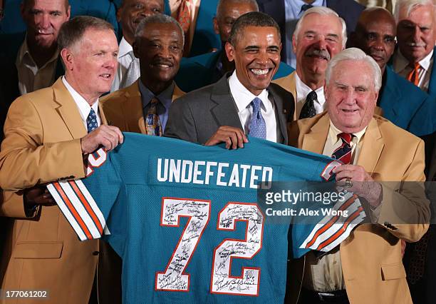 First row, U.S. President Barack Obama poses for photos with members of the 1972 Miami Dolphins including head coach Don Shula , quarterback Bob...