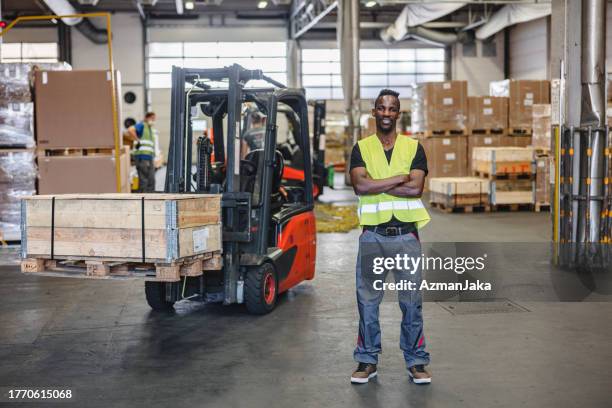 african american airport warehouse forklift operator - airport warehouse stock pictures, royalty-free photos & images