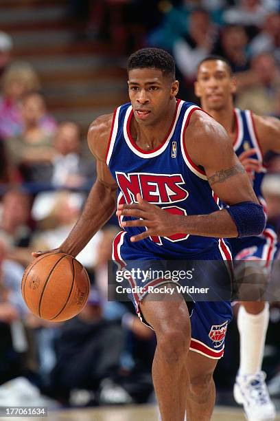 Kendall Gill of the New Jersey Nets dribbles the ball against the Sacramento Kings on March 3, 1997 at Arco Arena in Sacramento, California. NOTE TO...