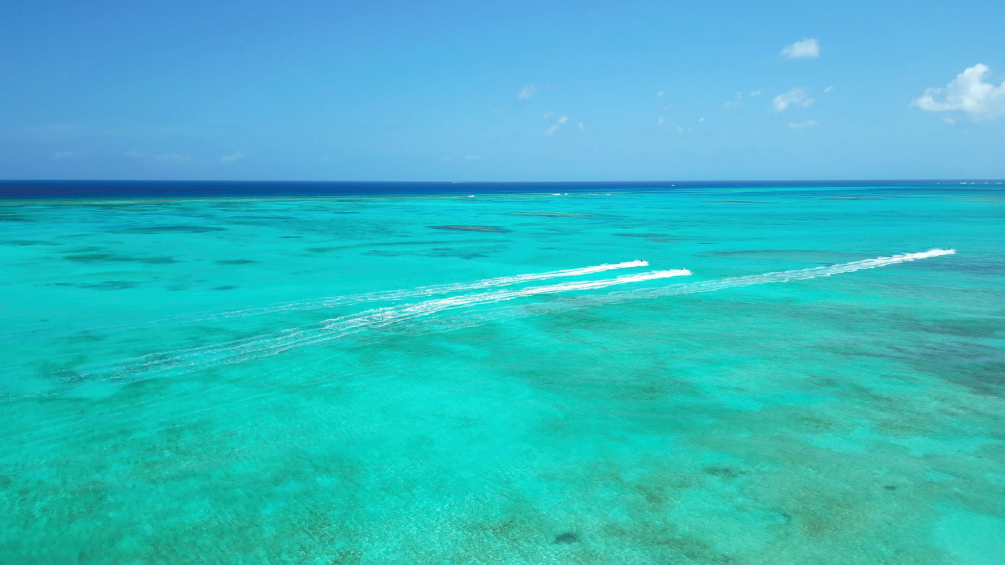 Aerial view of tropical sea and jetboats Aerial view of tropical sea and jetboats