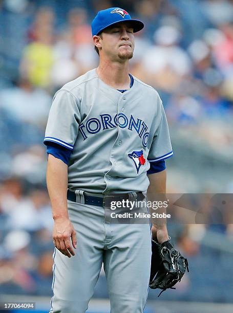 Thad Weber of the Toronto Blue Jays reacts during the seventh inning against the New York Yankees during the first game of a double header at Yankee...