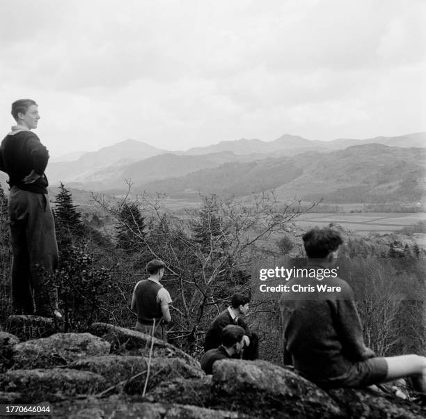 Teenage boys enjoying the view during a hill walking expedition near the Outward Bound Mountain School at Eskdale Green in Cumbria, April 1950.