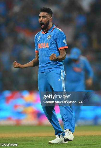 Mohammed Siraj of India celebrates the wicket of Dimuth Karunaratne of Sri Lanka during the ICC Men's Cricket World Cup India 2023 between India and...