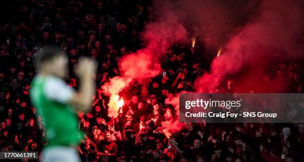 Aberdeen fans set off flares during a Viaplay Cup semi-final match between Hibernian and Aberdeen at Hampden Park, on November 04 in Glasgow,...