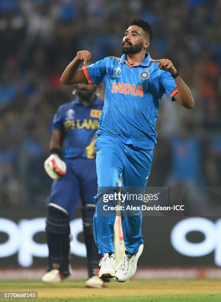 Mohammed Siraj of India celebrates the wicket of Kusal Mendis of Sri Lanka during the ICC Men's Cricket World Cup India 2023 between India and Sri...