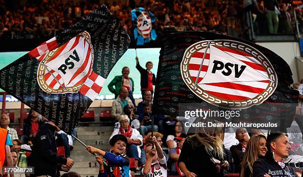 Fans show their support during the UEFA Champions League Play-off First Leg match between PSV Eindhoven and AC Milan at PSV Stadion on August 20,...