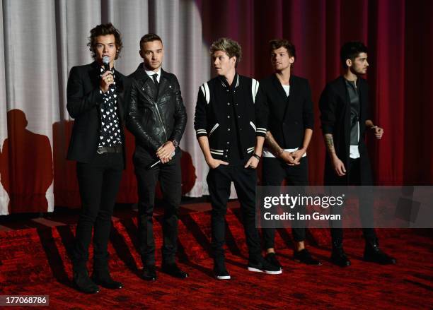 Harry Styles, Liam Payne, Niall Horan, Louis Tomlinson and Zayn Malik from One Direction speak on stage ahead of the "One Direction This Is Us" world...