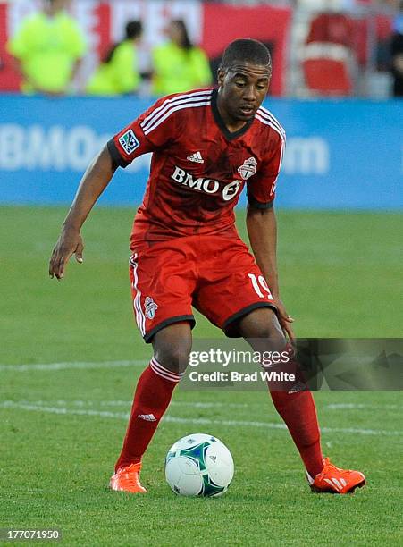 Reggie Lambe of the Toronto FC runs with the ball during MLS game action against the Seattle Sounders FC August 10, 2013 at BMO Field in Toronto,...
