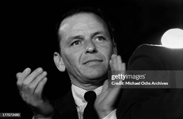 Singer Frank Sinatra attends a campaign event for Democratic presidential nominee John F. Kennedy on November 1 in San Francisco, California.