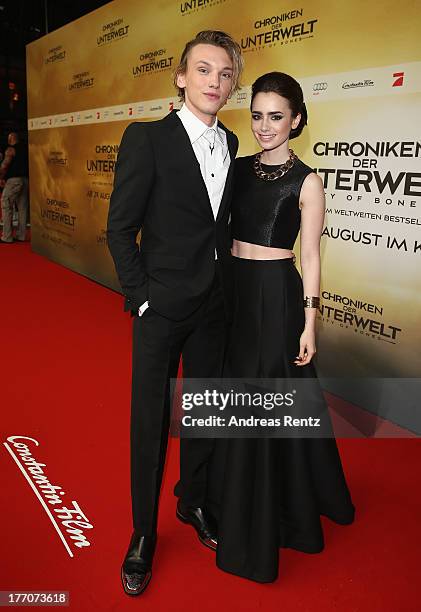 Jamie Campbell Bower and Lily Collins arrives for the 'The Mortal Instruments: City of Bones' Germany premiere at Sony Centre on August 20, 2013 in...