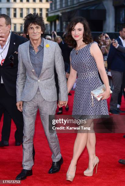 Ronnie Wood and Sally Wood attend the World Premiere of 'One Direction: This Is Us' at Empire Leicester Square on August 20, 2013 in London, England.