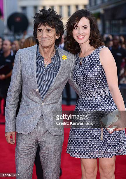Ronnie Wood and Sally Wood attend the World Premiere of 'One Direction: This Is Us' at Empire Leicester Square on August 20, 2013 in London, England.