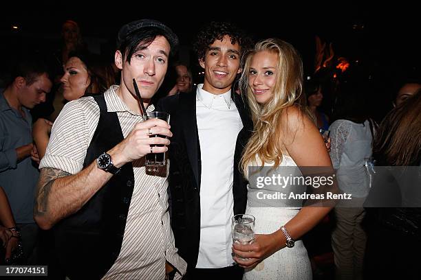 Actor Robert Sheehan with Joel and Moly attend the after show party to the 'The Mortal Instruments: City of Bones' Germany premiere at Puro Lounge on...