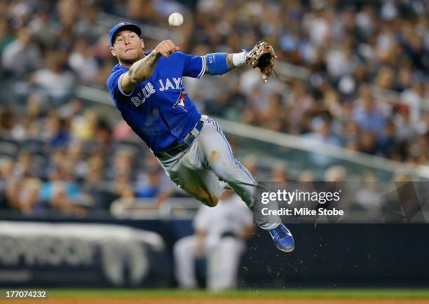 Brett Lawrie of the Toronto Blue Jays fields a ground ball for an out against the New York Yankees during the second game of a doubleheader at Yankee...