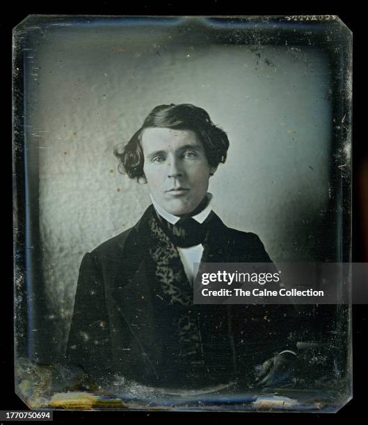 6th Plate Early American Daguerreotype of A Handsome Man Standing In Front Of An Itinerant's Cloth Backdrop On An Early Scovills Silver Plate, circa...