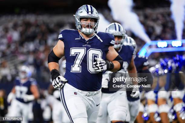 Zack Martin of the Dallas Cowboys runs out of the tunnel prior to an NFL game against the Los Angeles Rams at AT&T Stadium on October 29, 2023 in...