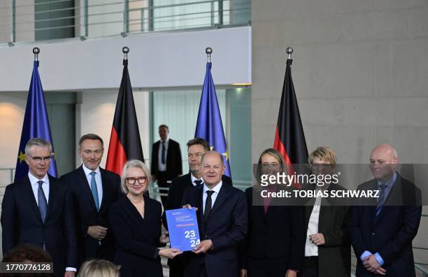 German Chancellor Olaf Scholz poses together with German Finance Minister Christian Lindner , German Minister of Economics and Climate Protection...