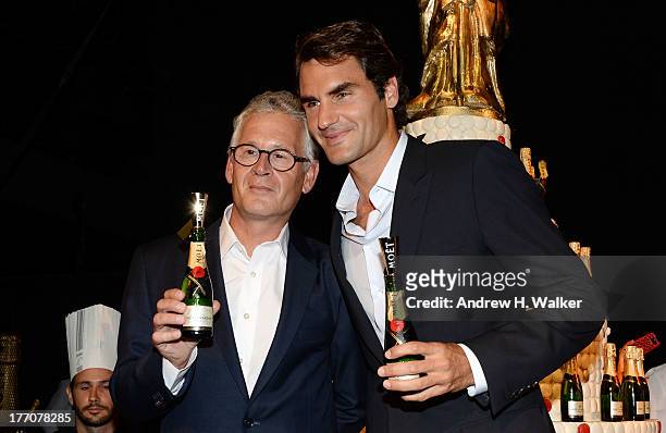 Moet & Chandon CEO Stephane Baschiera and Professional Tennis Player Roger Federer speak onstage at Moet & Chandon Celebrates Its 270th Anniversary...