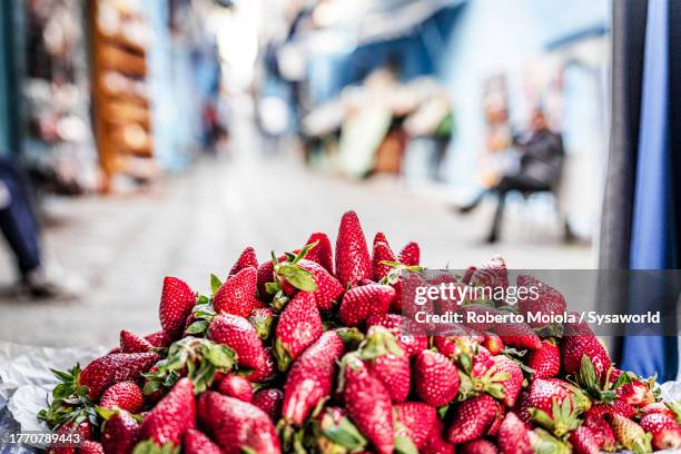 fresh strawberries on sale in a street market - morocco stock pictures, royalty-free photos & images