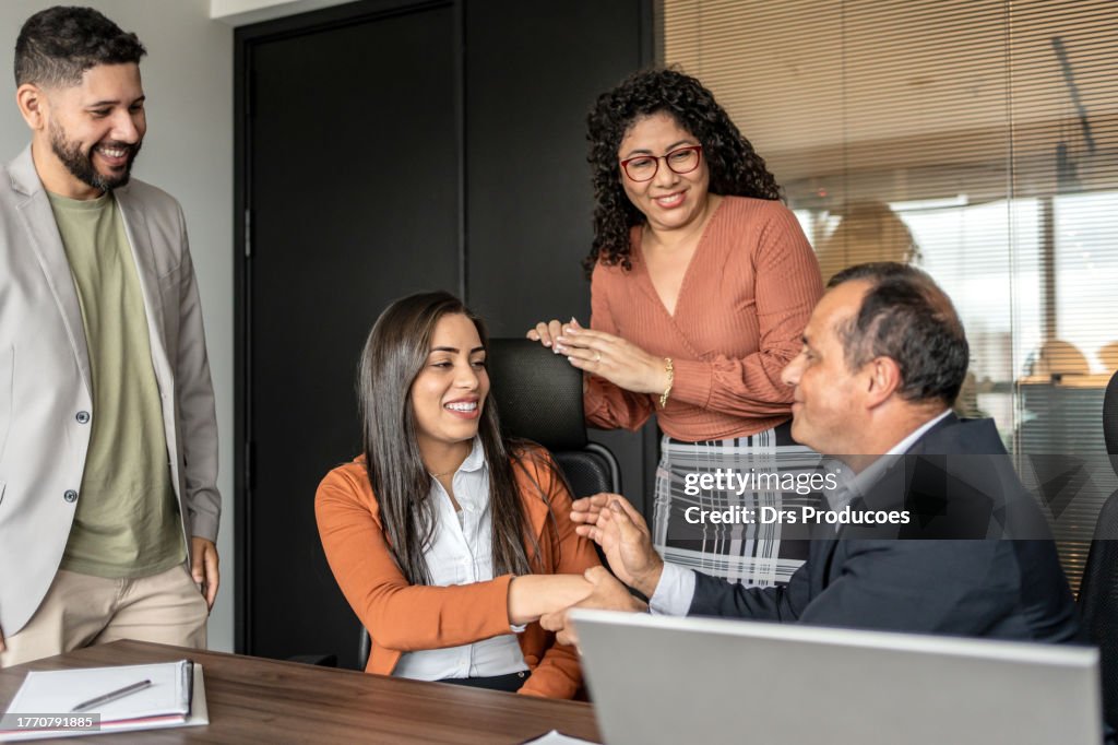 Congratuated Business Woman Being Congratulated By Colleagues At Work High-Res Stock ...