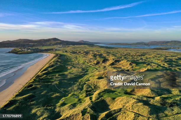 An aerial view of the par 3, 15th hole on the Old Tom Morris Links in the left foreground with the par 4, sixth hole on the Sandy Hills Links in the...