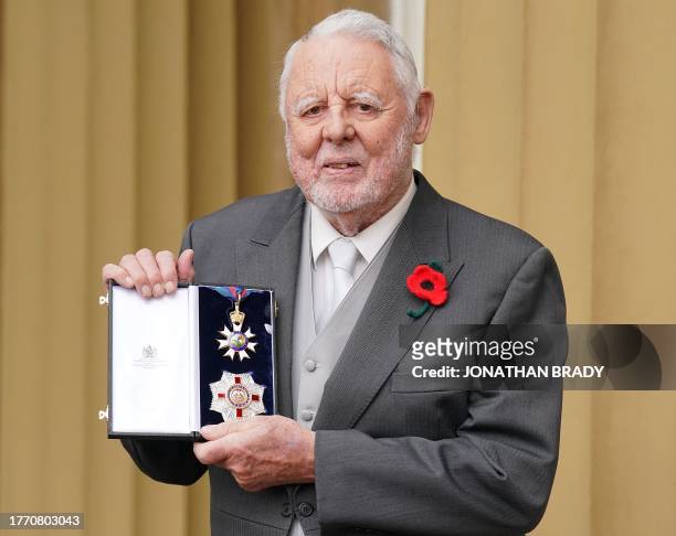 Terry Waite poses with their medal and insignia after being appointed as a Knight Commander of the Order of St Michael and St George for his services...