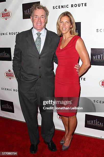 John McGinley and Nichole McGinley arrive to the "Scenic Route" Los Angeles Premiere at Chinese 6 Theater Hollywood on August 20, 2013 in Hollywood,...