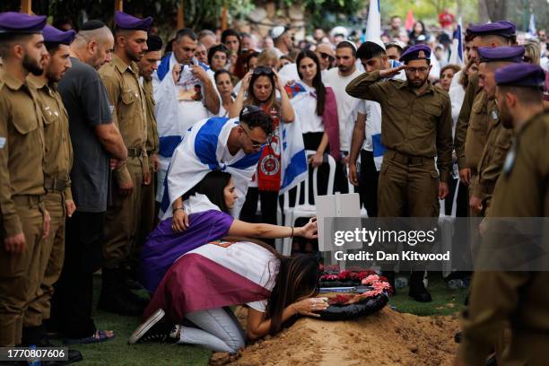 Family members react at Mount Herzl cemetery during the funeral of Sgt. Roi Daoui on November 2, 2023 in Jerusalem, Israel. This week, the Israeli...