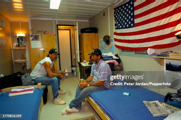 Employees relax in an accomodation trailer in a compound housing Bechtel construction workers building the Maghreb-Europe Gas Pipeline in the desert...