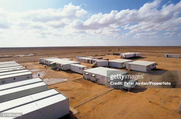 Aerial view of a compound housing Bechtel construction workers building the Maghreb-Europe Gas Pipeline in the desert interior of Algeria in...