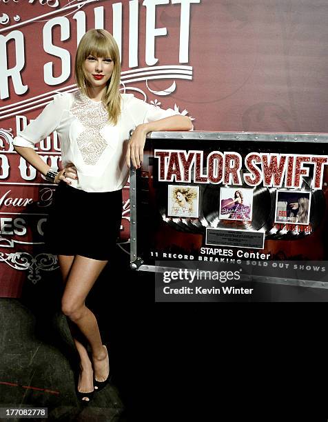 Musician/actress Taylor Swift, wearing Elie Saab top and shorts, attends a press event for breaking The Staples Center's record of most sold-out...