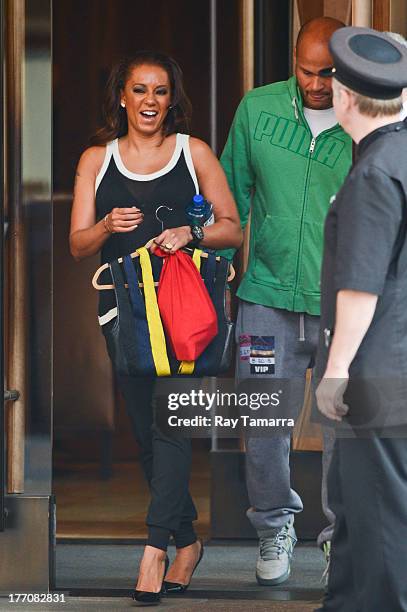 Personality Melanie Brown and Stephen Belafonte leave their Soho hotel on August 20, 2013 in New York City.