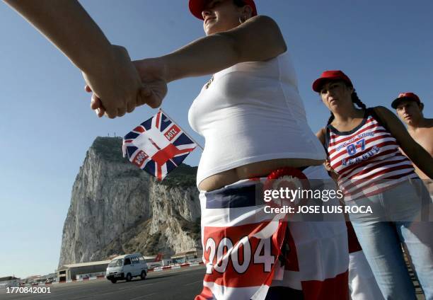 People form a human chain in Gibraltar 04 August 2004. The parliament on Gibraltar, Britain's tiny possession also claimed by Spain, will reaffirm...