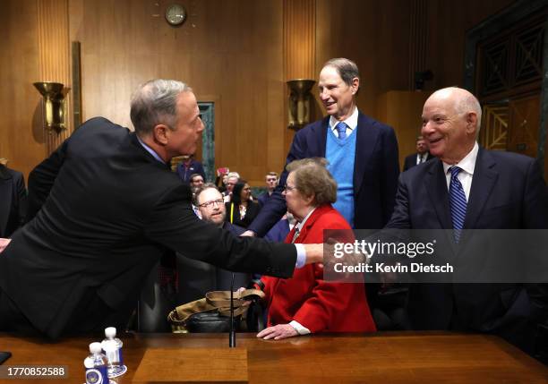 Former Gov. Martin O'Malley , President Biden's nominee to be the next Commissioner of Social Security, shakes hands with U.S. Sen. Ben Cardin as...